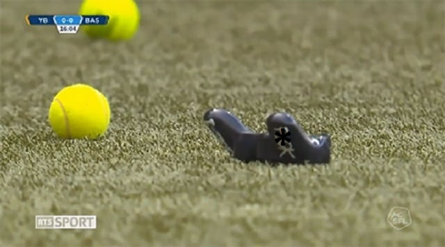 tennis balls and controller on the field