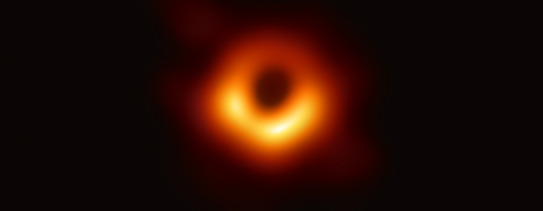 The black hole at the center of M87 as imaged by EHT.